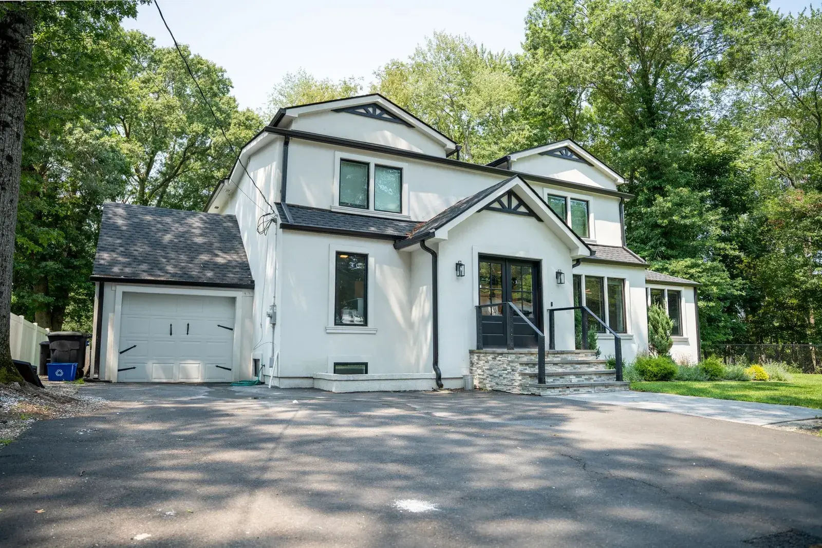 Closter Residence I, a renovated white stucco home, front porch and doors, Closter, NJ