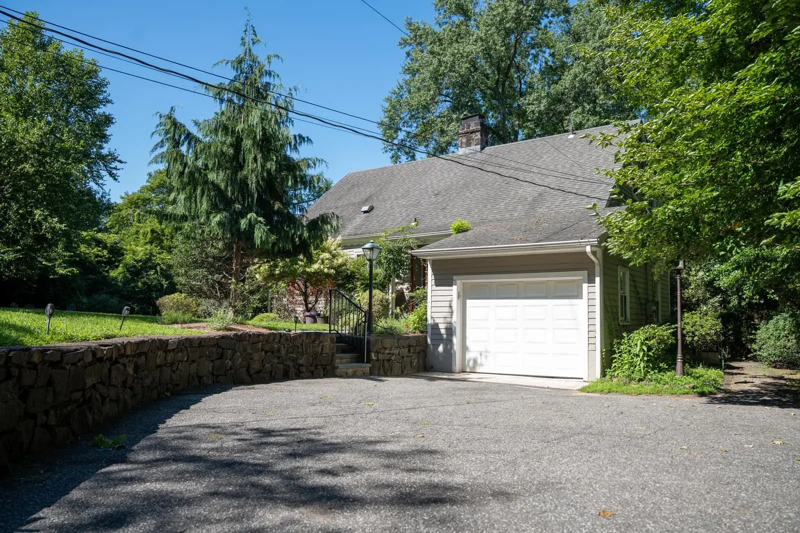 Driveway, stone wall and garage at Closter Residence II, Closter, NJ