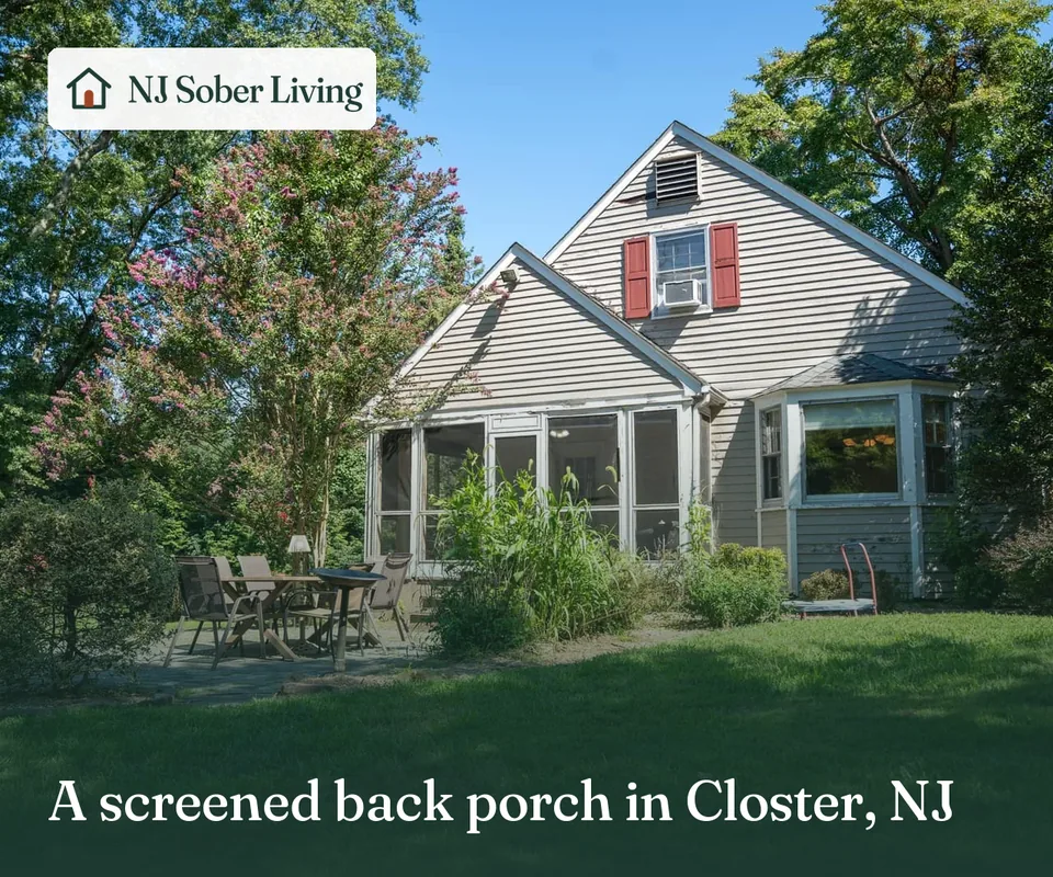 Closter Residence II, the house with the red front door: its screened back porch and patio, with the NJ Sober Living logo and "A screened back porch in Closter, NJ" text