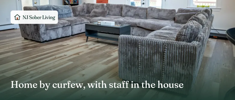 House rules at NJ Sober Living in Old Tappan, NJ: the shared living room, with the NJ Sober Living logo and "Home by curfew, with staff in the house" text