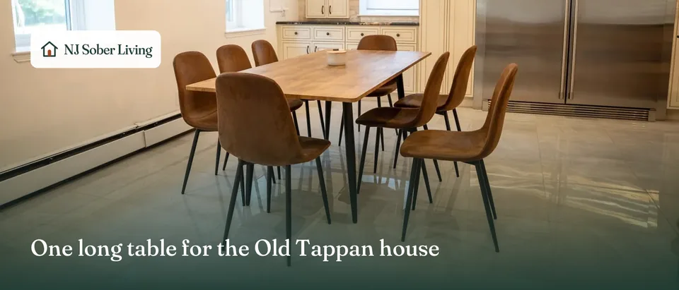 The shared table at the Old Tappan sober living house, NJ: the dining room, with the NJ Sober Living logo and "One long table for the Old Tappan house" text
