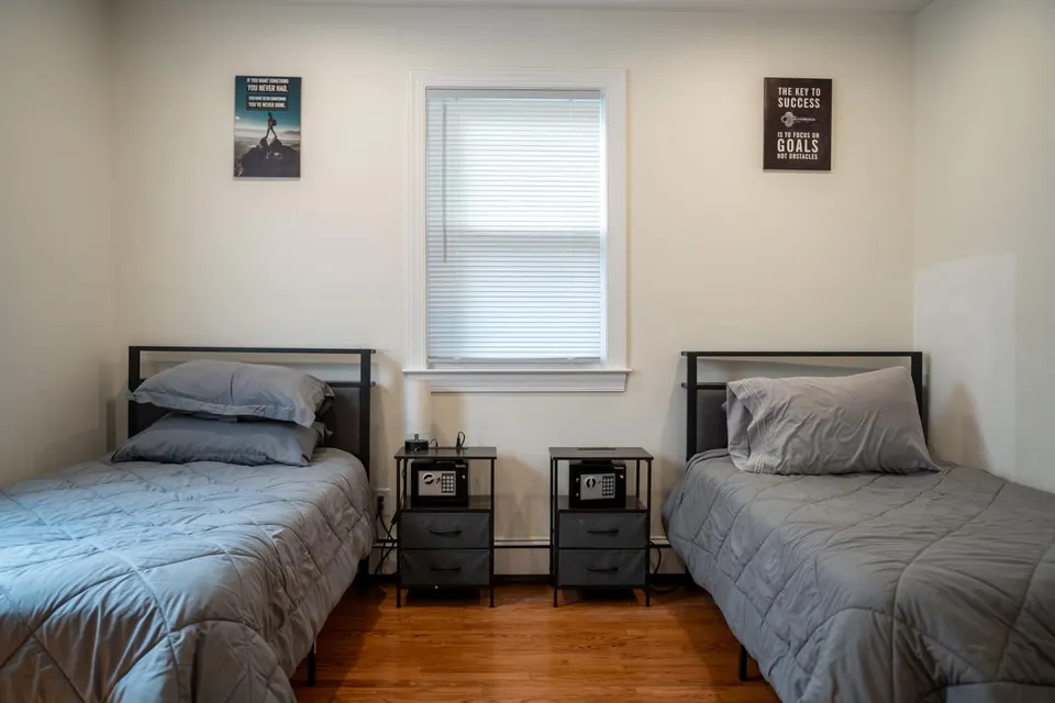 A second shared bedroom with two twin beds in the Old Tappan house