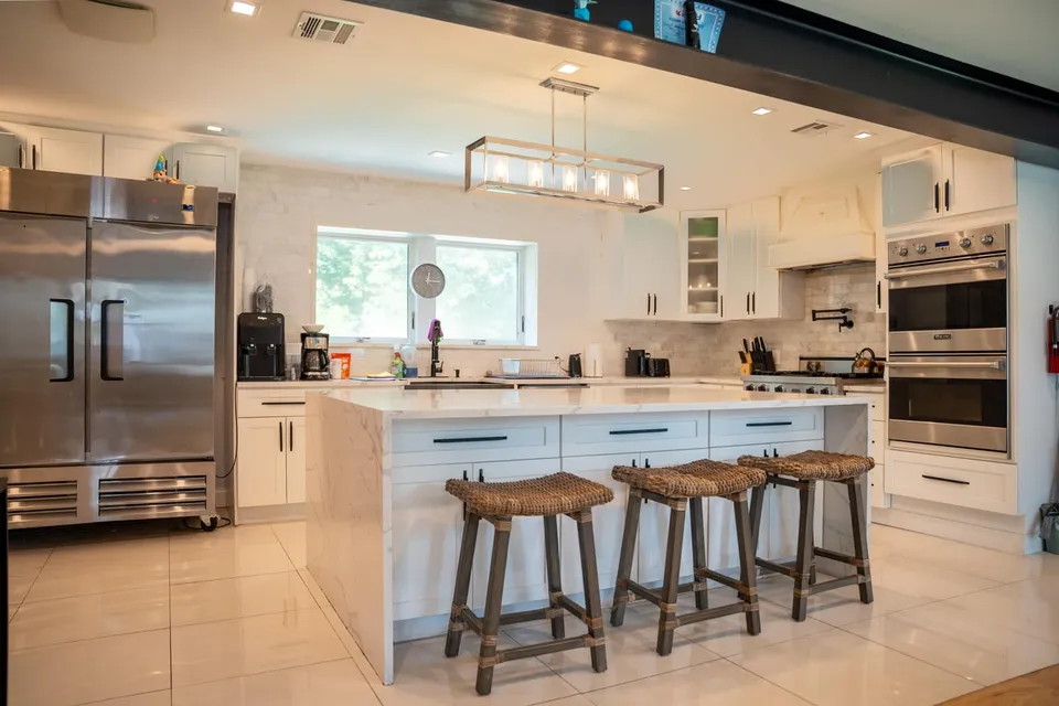 Kitchen with a long island and stools, Closter Residence I, Closter, NJ